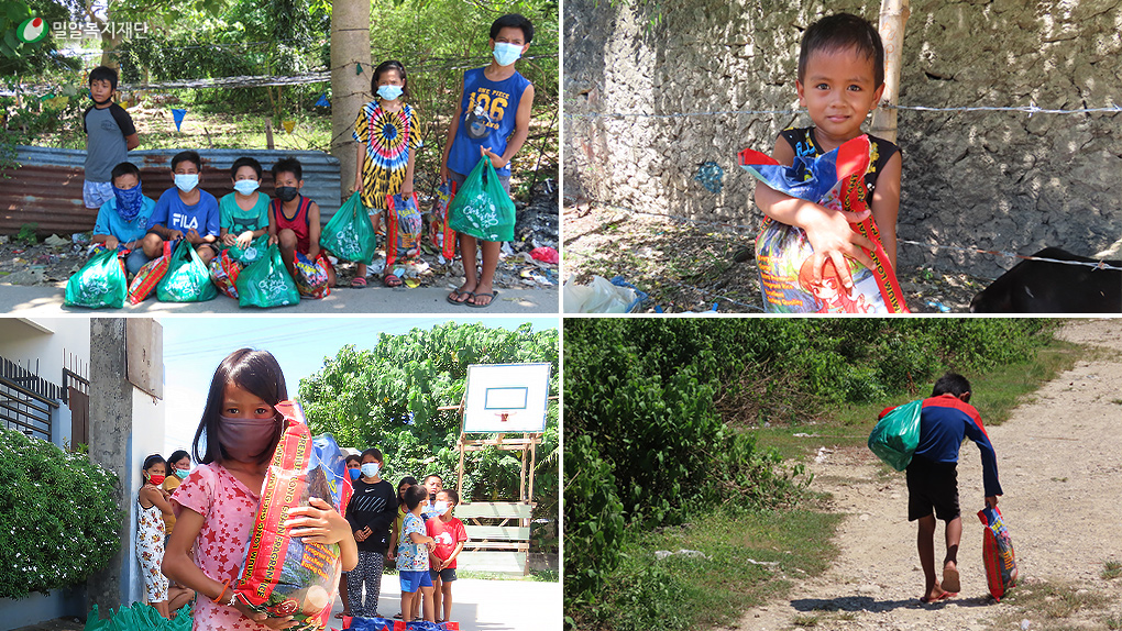 긴급생계지원 물품을 받은 아이들.jpg
